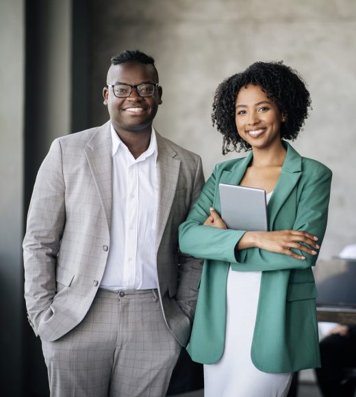 Happy Couple Of Black Coworkers Posing At Modern Office Interior